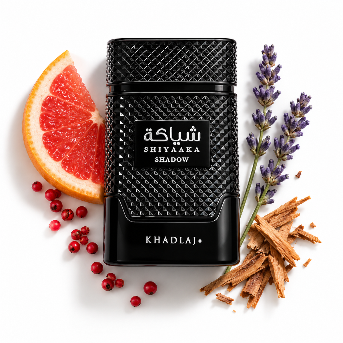 Khadlaj Shiyaaka Shadow 100ml bottle on a white background with grapefruit, pink pepper, lavender and cedarwood