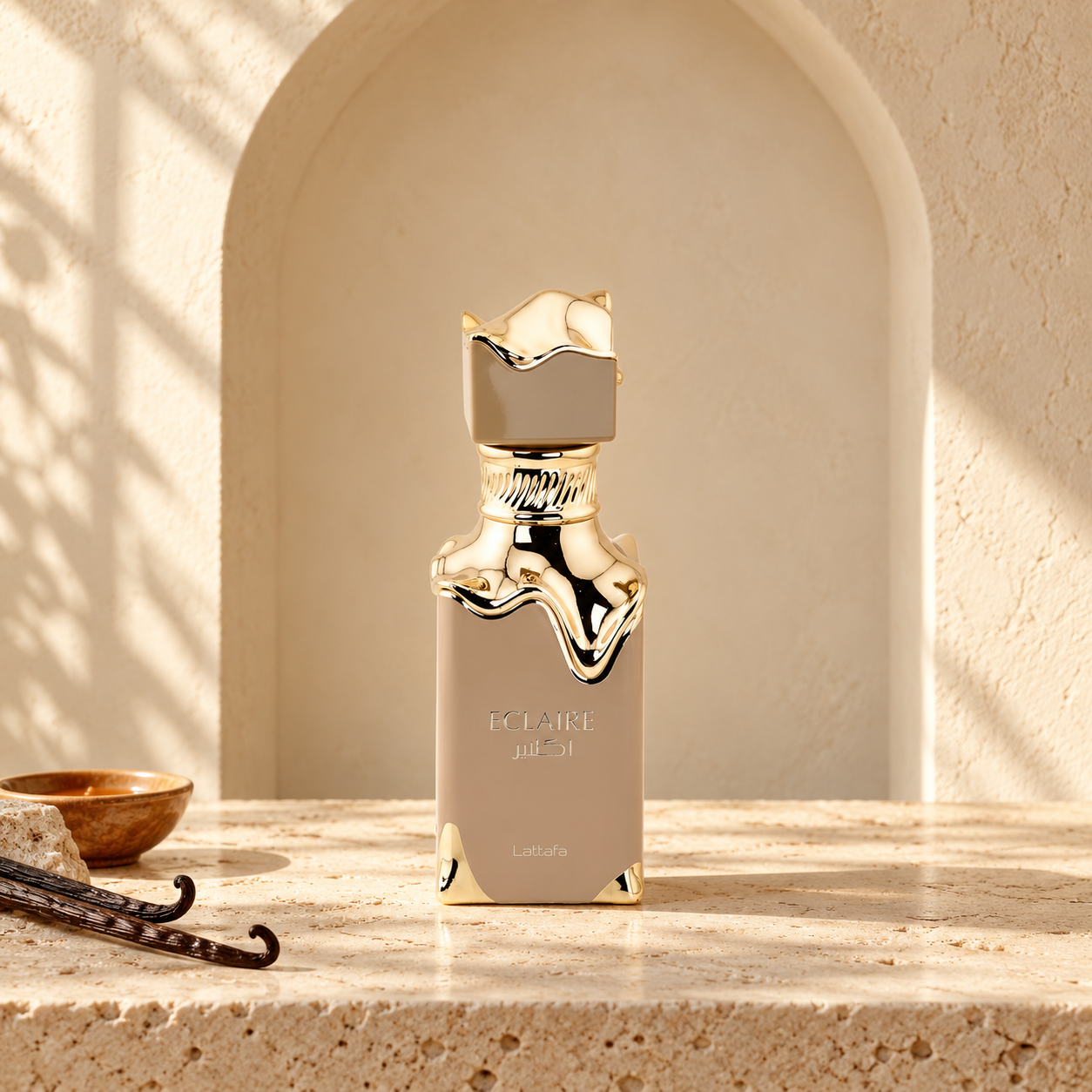 Original Lattafa Eclaire with vanilla pods in a warm cream Arabian arch setting