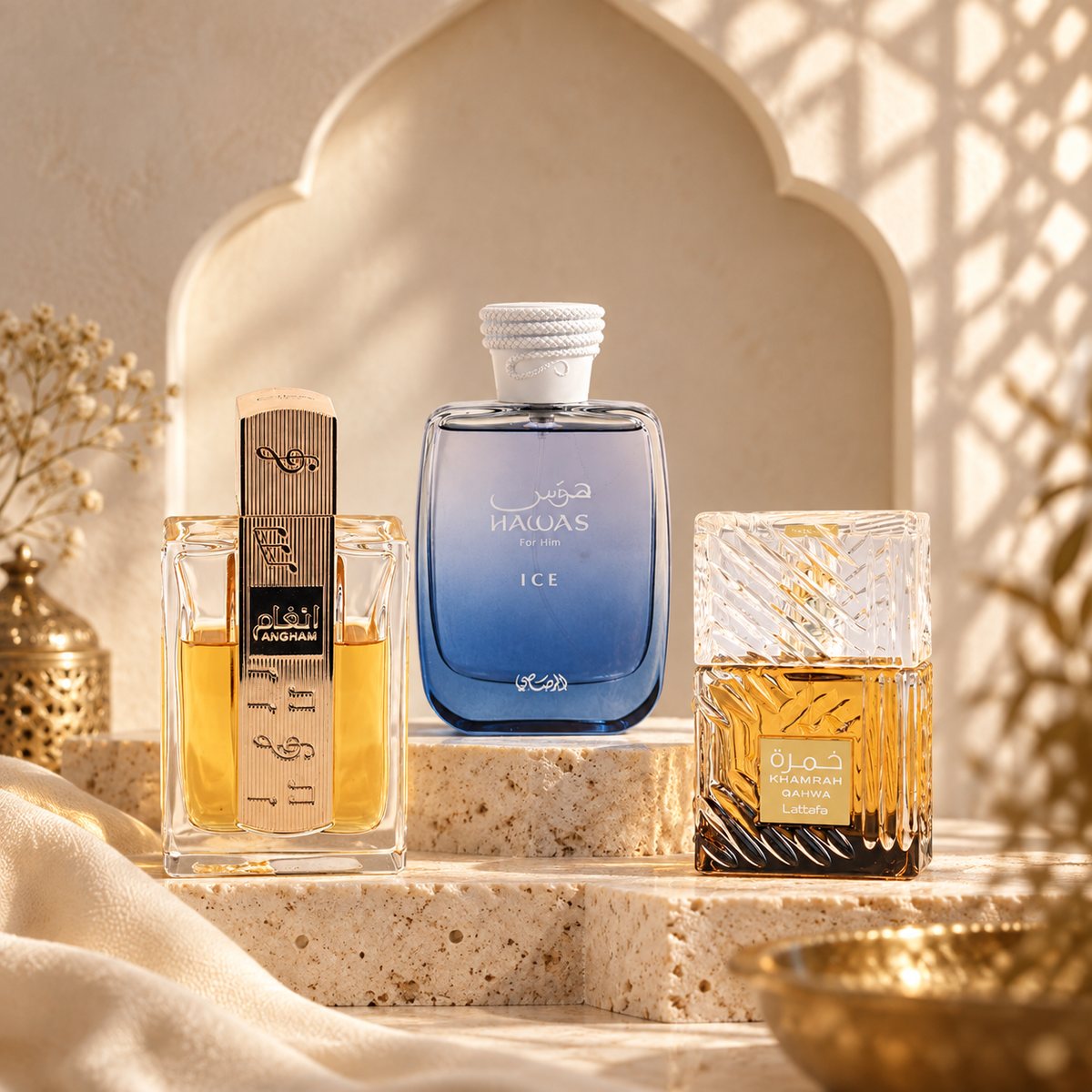 Lattafa Angham, Rasasi Hawas Ice and Khamrah Qahwa displayed in a softly lit cream Arabian arch